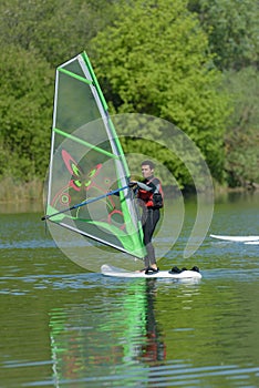 man during wind surfing practice