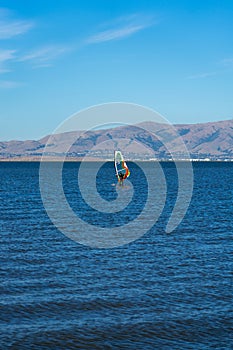 A man windsurfing at Palo Alto Boat Launch, California , USA