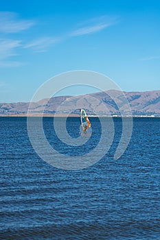 A man windsurfing at Palo Alto Boat Launch, California , USA