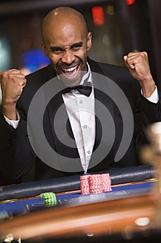 Man winning at roulette table