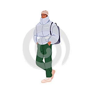 Man in winter apparel, warm jacket, sport shoes, sneakers, hat. Young guy with backpack, wearing casual clothes, outfit