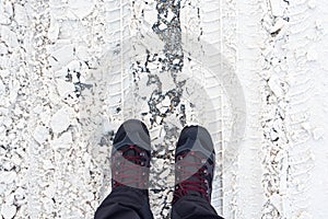 Man in winter boots standing in snow