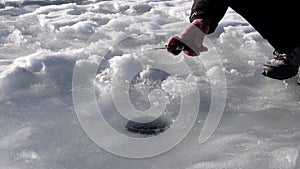 A man on a winter fishing trip.