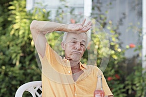 Man wiping his sweat