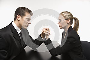 Man and woman arm wrestling