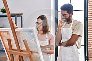 Man and woman artists drawing at art studio