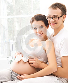 Man and woman awaiting a baby. Family at home