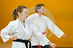 man and woman beating punch arm