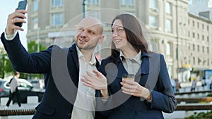 A man and a woman begin to communicate via video online using a smartphone