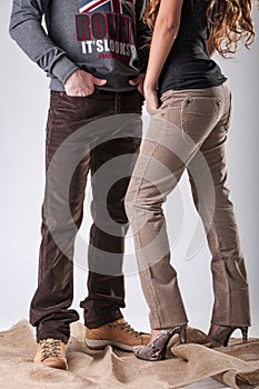 A man and a woman in brown corduroy trousers