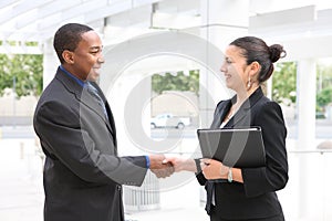 Man and Woman Business Team Handshake