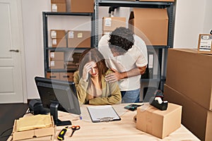 Man and woman business workers with sad expression working at office