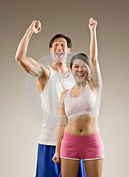 Man and woman cheering