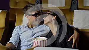 Man and woman in the cinema watching a 3D movie