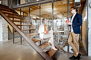 Man and woman during the coffee break in the office