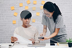 Man woman colleagues analyzing data on computer. startup teamwork team working at office