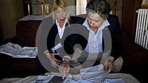 Man and woman counting expenses, checking bills for utilities, family budget