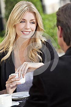 Man and Woman Couple Drinking Coffee At Cafe