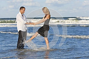 Man and Woman Couple Having Fun Dancing On A Beach