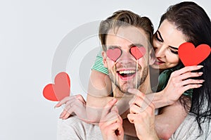 Man and woman couple in love hold red heart valentines cards white background. Valentines day concept. Valentines day