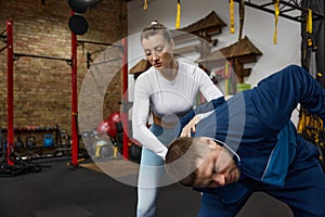 Man and woman couple training indoors at sport studio
