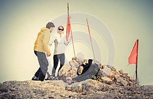 Man and Woman couple Travelers on Mountain summit