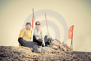 Man and Woman couple Travelers on Mountain summit