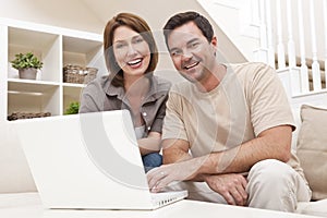 Man Woman Couple Using Laptop Computer At Home