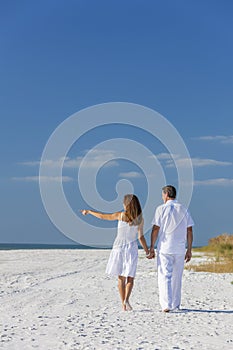 Man Woman Couple Walking Pointing on Empty Beach