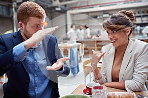 Man and woman coworkers socializing on a brake