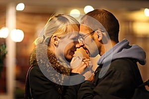 Man and woman is cuddling in coldly nightly fall c photo