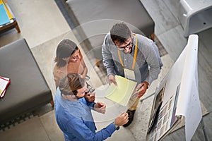 Man and woman customer with salesman in store furniture for the house