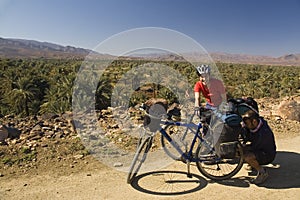 Man and woman cycling in south Morocco