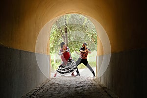 Man And Woman Dancing Flamenco In Traditional Clothes photo