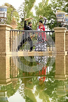 Man And Woman Dancing Flamenco In Traditional Clothes photo