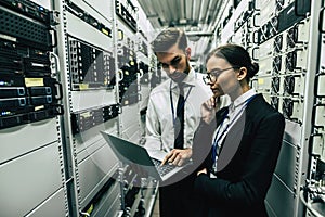 Man and woman in data centre photo