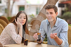 Man and woman dating but she is boring while he speaks