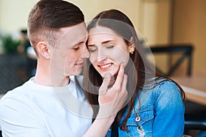 Man and woman dating in cafe . Happy couple drinking coffee in outdoors cafe on summer vacation