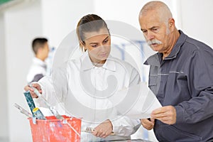 Man and woman discussing new paint colors