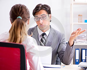 Man and woman discussing in office