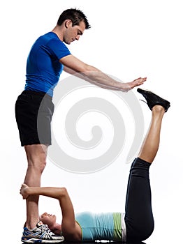 Man and woman doing abdominals workout push ups photo
