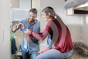 Man And Woman Doing Chores Washing Clothes