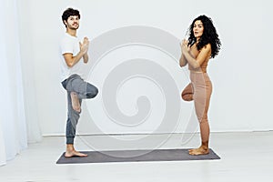 Man And Woman Doing Couple Yoga Fitness Gymnastics Asana