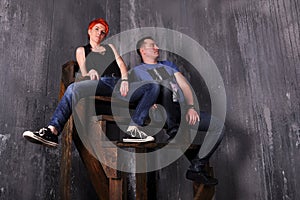 man and woman doing a fashion photo shoot in a professional studio