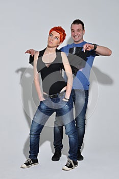 man and woman doing a fashion photo shoot in a professional studio