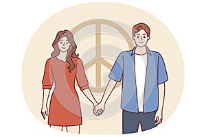 Man and woman dressed in casual style hold hands standing near symbol of pacifism. Vector image