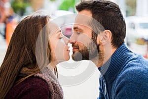 Man and woman drinking tea or coffee. Picnic. Drink warm in cool weather. Happy couple with coffee cups in autumn park. Love story