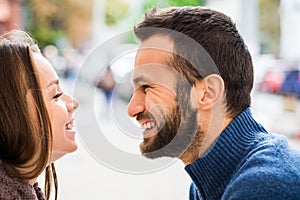 Man and woman drinking tea or coffee. Picnic. Drink warm in cool weather. Happy couple with coffee cups in autumn park. Love story