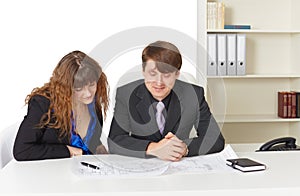 Man and woman - engineers, working in office