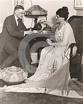 Man and woman enjoying tea time at home